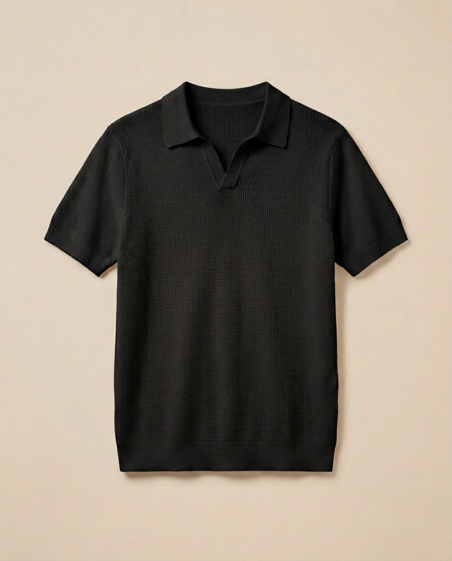 Amalfi Knit Polo in Noir, front packshot on a warm beige background